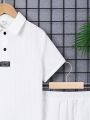 SHEIN Kids Academe Boys' Loose Fit College Style Turn-Down Collar Woven Short Sleeve Shirt And Shorts Set