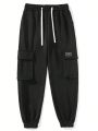 Manfinity Hypemode Men's Loose Fit Jogger Pants With Flap Pockets And Tapered Cuffs
