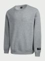 SHEIN Extended Sizes Men'S Plus Size Knit Casual Round Neck Sweatshirt